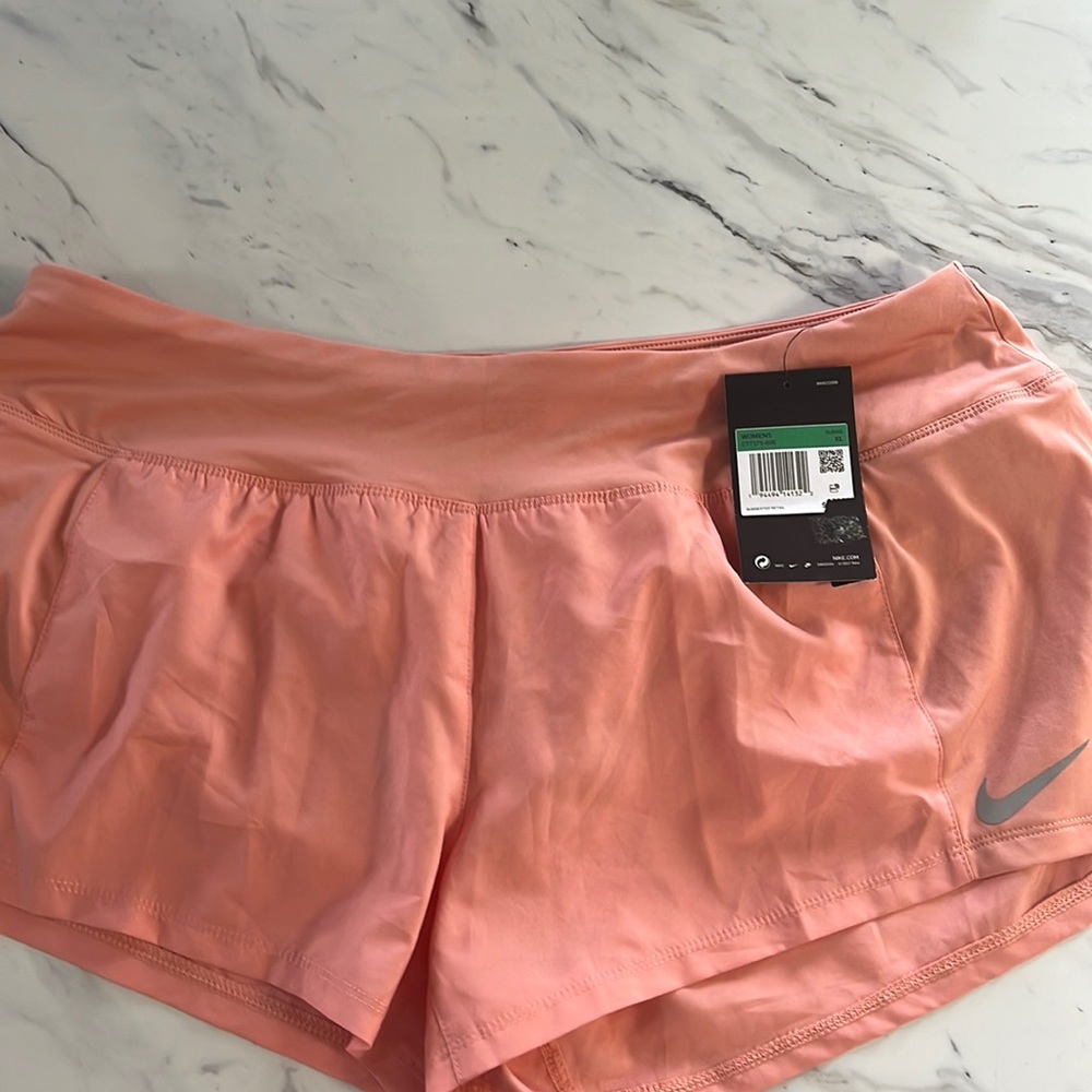 XL coral colored women’s Nike running shorts. Brand new with tags